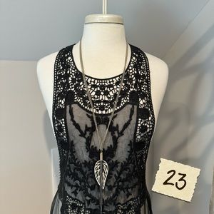 Metal feather necklace.